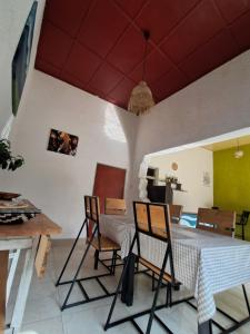 a dining room with a table and chairs at Saish Stay in Ruhengeri