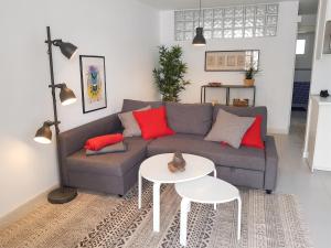 a living room with a couch and a table at Charming Apartment in Tías + Pool in Tías
