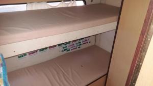 a cupboard in a room with a shelf at Gradishte beach Ohrid in Ohrid