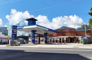 a gas station on the side of a road at MBC Hotel in Guinlajong
