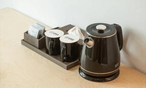 a coffee maker sitting on top of a table at Hotel Opus in Gyeongju