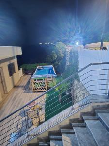 a set of stairs leading up to a swimming pool at נוף המצוק בגליל in Even Menahem