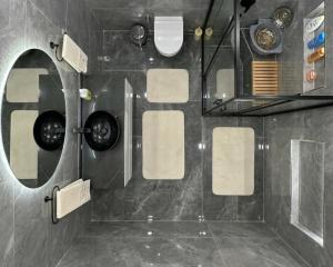 a bathroom with a shower with white towels at 2 bedrooms living apartments in Lahore