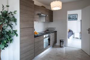 a kitchen with a sink and a counter top at Rooftop privé - Clim - Place Carnot - Wifi in Carcassonne
