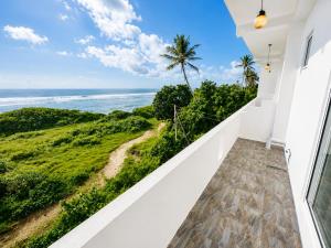 a balcony with a view of the ocean at Blue Waves Ocean Mirissa in Mirissa +19 photos