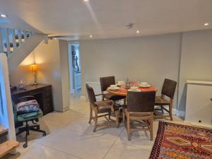 a dining room with a table and chairs at Dovetail Cottage in Wexford +20 photos