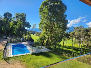 an aerial view of a house with a swimming pool at The Shed House in Mount Beauty
