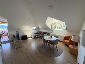 a living room with a table and a couch at Villa Fragola in Doli