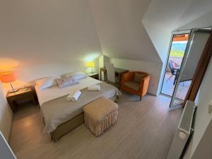 a small bedroom with a bed and a chair at Villa Fragola in Doli