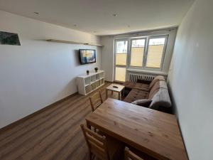 a living room with a couch and a table at Zamkowa18 in Pabianice