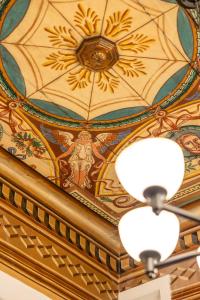 a ceiling with a flower painted on it at "LOS" 1 Neoclassic Harbour View in Symi