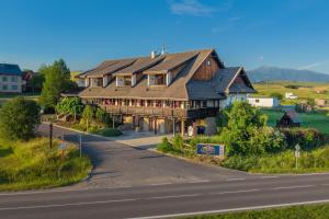 an overhead view of a large house on a road at Serenity Residence Hotel & Wellness in Liptovský Trnovec