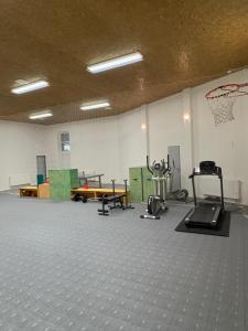 an empty gym with a basketball hoop on the wall at Apartmán Všemina 346 in Všemina