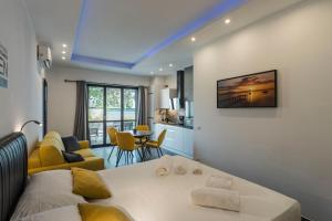 a bedroom with a bed and a living room at Lake Apartment Primea in Sirmione
