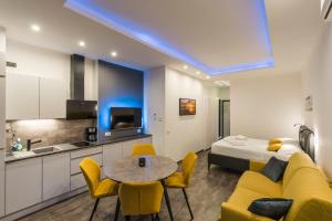 a room with a bed and a table and chairs at Lake Apartment Primea in Sirmione