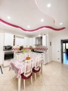 a kitchen with a table and chairs in a room at Il Borgo in Agerola