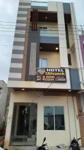 a building with a sign on the front of it at Hotel shivansh in Godarpura