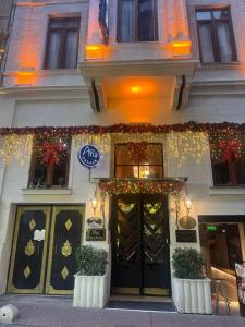 a store with christmas lights on the front of a building at Aria Palace Taksim & Spa in Istanbul