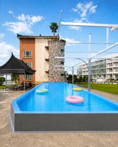 a pool with three frisbees in the water at Jeju Nine resort in Jeju