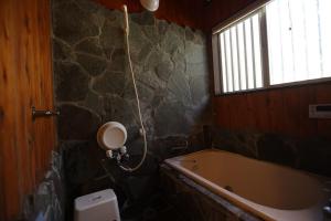 a bathroom with a bath tub and a window at 木漏れ日の森で都会では味わえない静寂を那須の自然を満喫する貸別荘つつじ山 in Nasu +42 photos