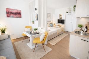 a bedroom and living room with a bed and a kitchen at Studio apartment with pool in Pula