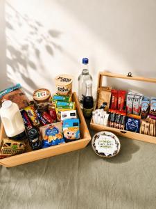 two wooden trays filled with different types of food at Lazy Acre Apartment - Heart of East Anglia in Hopton