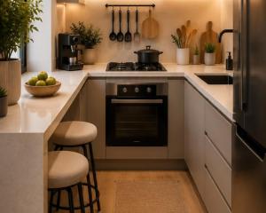 a kitchen with a stove and a bowl of fruit on a counter at Luxury apartment With 3 Ac and Free Parking in Lahore