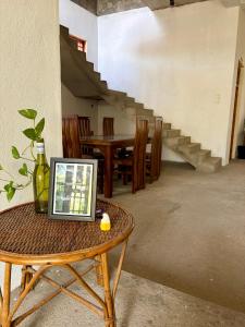 a table with a laptop sitting on top of it at ThePopos in Arugam Bay