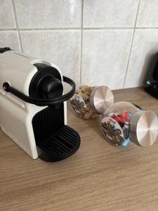 a coffee maker sitting on top of a counter at Studio Centre Strasbourg in Strasbourg