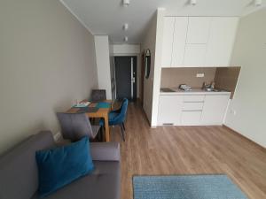 a living room with a couch and a table at Omega Dom in Vrnjačka Banja