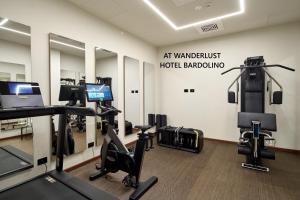 a gym with treadmills and exercise equipment in a building at WANDERLUST VILLETTE a SCHIERA - Bardolino, Lago di Garda - Verona in Bardolino