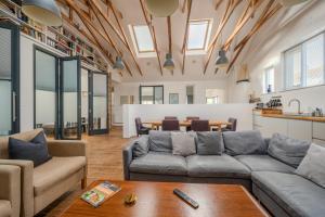 a living room with a couch and a table at Ebenezer Hall in Falmouth