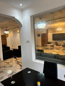 a reflection of a living room in a mirror at Good Deeds Realty in Elmina