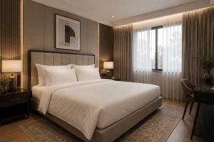 a bedroom with a large white bed and windows at Hotel Airport Elite Suit Near Delhi Airport in New Delhi