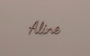 a sign that says alline on a wall at Logies De Lelie in Antwerp
