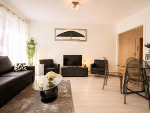 a living room with a couch and a table at Champs elysees apartment 4 in Paris