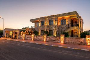 a building on the side of a street at Louis Cappadocia in Uçhisar +75 photos