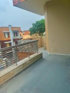 a balcony of a building with a railing on it at Om Homestay in Panchkula