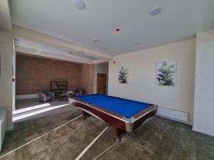 a large room with a pool table in it at Verde Resort in Ikalto