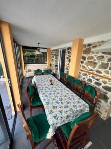 a dining room with a table and chairs at Vila 4 Stinet in Pogradec