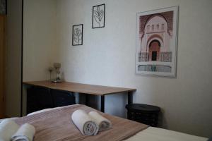 a room with two beds and a desk and a table at Titanium in Izola +33 photos