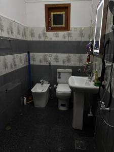 a bathroom with a toilet and a sink at Casa Bella Home in Ja-Ela +56 photos