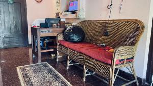 a room with a chair with a desk and a bag on it at SEVENSTAR RESIDENCY in Varkala