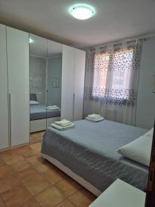 a bedroom with two beds and a mirror at Castello Vignola in Vignola