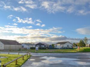 a residential street with houses and a cloudy sky at Number 150 in Bessingby