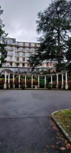 an empty parking lot in front of a large building at Studio moderne Évian, lac et therme in Évian-les-Bains
