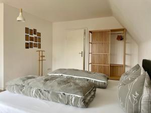 a bedroom with two pillows on a bed at Ferienhaus L45 in Elsterheide