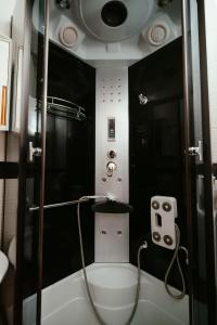 a small bathroom with a shower with a toilet at Prenočište M & S in Valpovo +53 photos