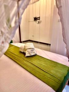a close up of a bed in a room at villa Senoa in Ahangama