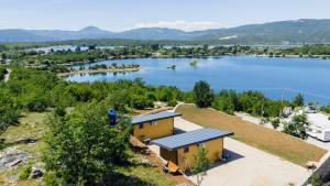an aerial view of a house with a lake at Lenka & Anika in Nikšić +16 photos